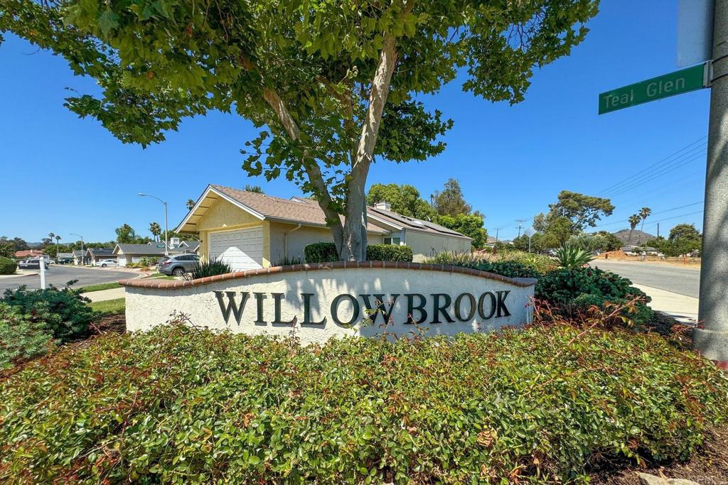 2131 Teal Glen Escondido, CA 92026 - Photo 1 of 35 a view of outdoor space with signage and flags