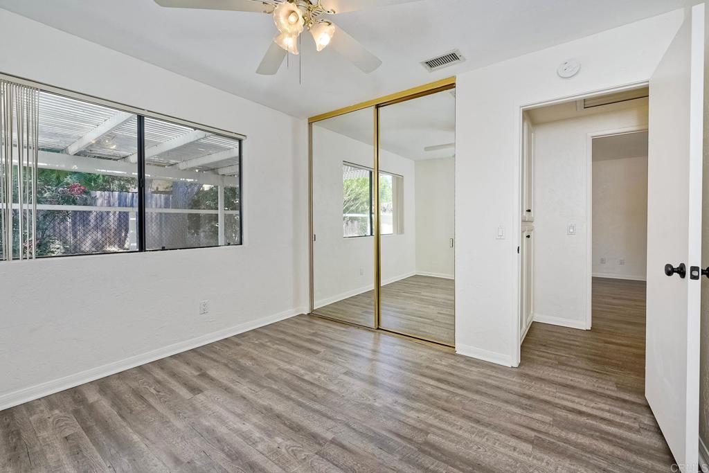 2131 Teal Glen Escondido, CA 92026 - Photo 20 of 35 a view of an empty room with wooden floor and a window