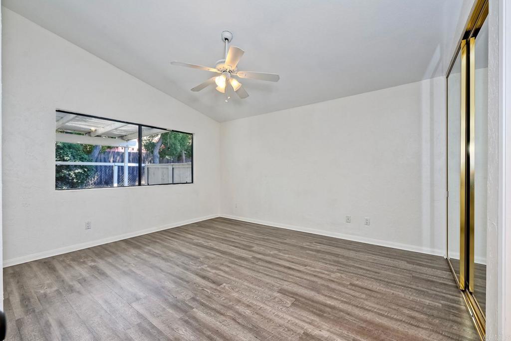 2131 Teal Glen Escondido, CA 92026 - Photo 21 of 35 a view of empty room with wooden floor and fan