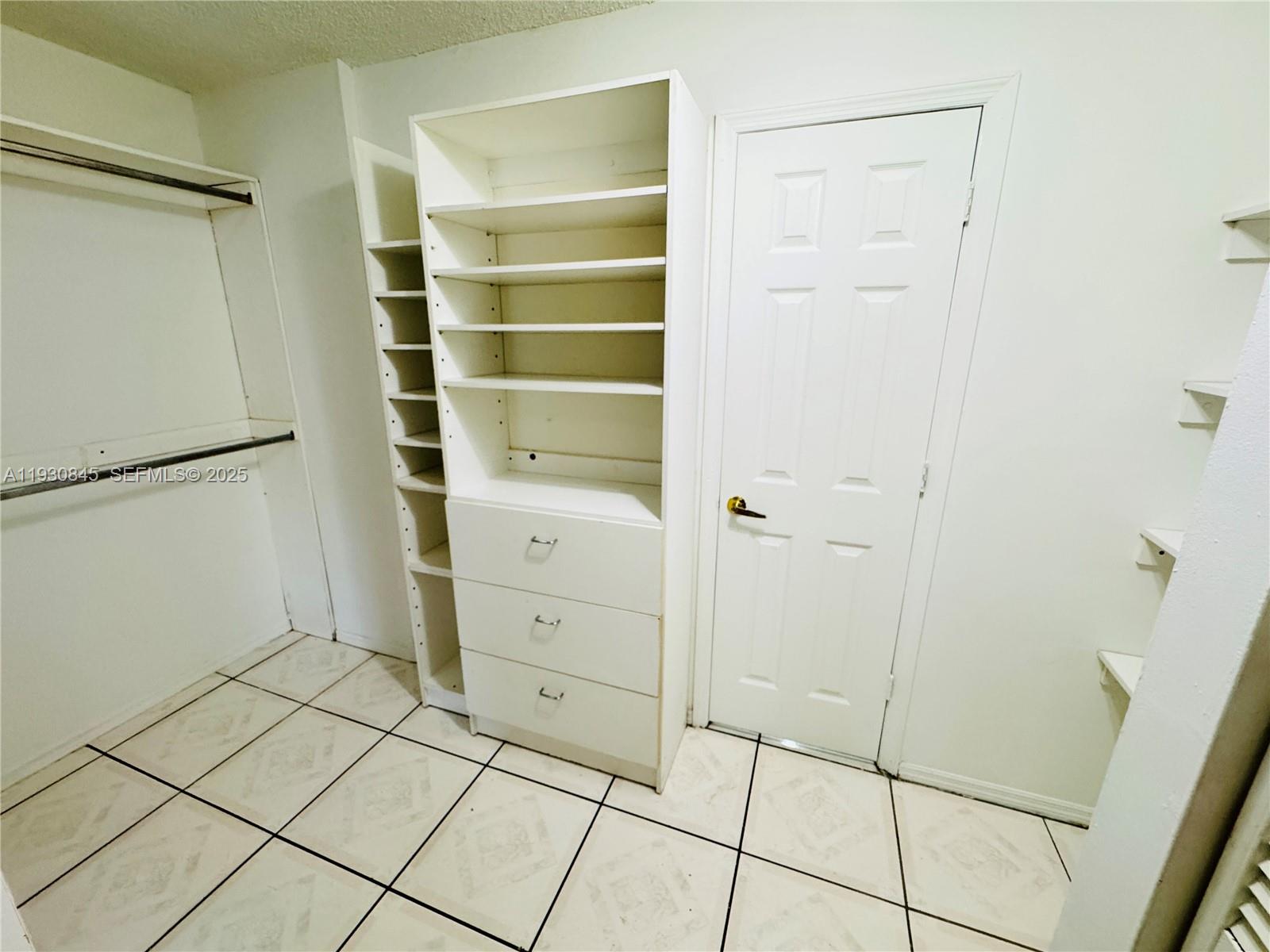 2800 Northwest 56th Avenue, Unit D102 Lauderhill, FL 33313 - Photo 15 of 25 a view of an empty walk in closet