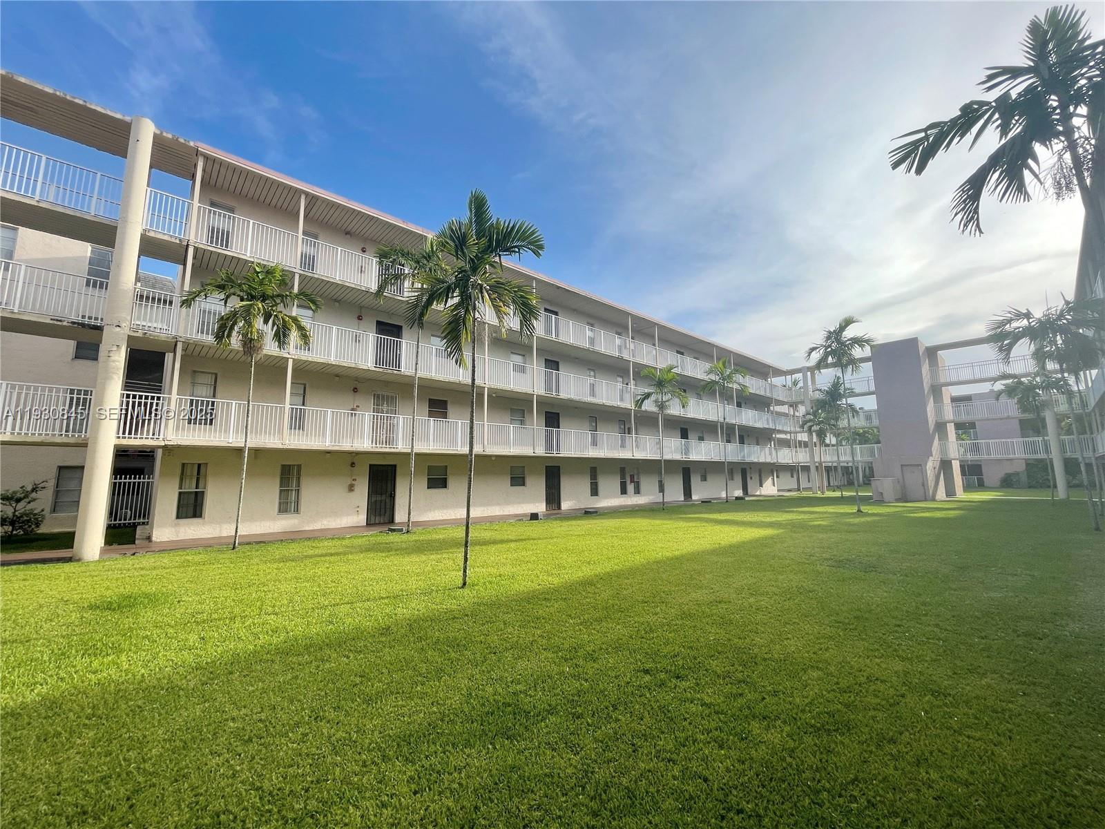 2800 Northwest 56th Avenue, Unit D102 Lauderhill, FL 33313 - Photo 18 of 25 a view of building with yard