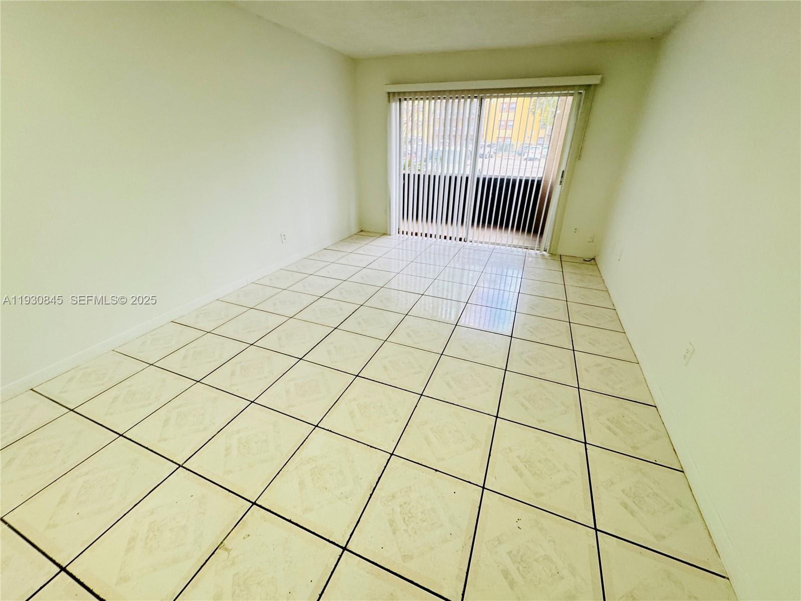 2800 Northwest 56th Avenue, Unit D102 Lauderhill, FL 33313 - Photo 2 of 25 a view of an empty room and window