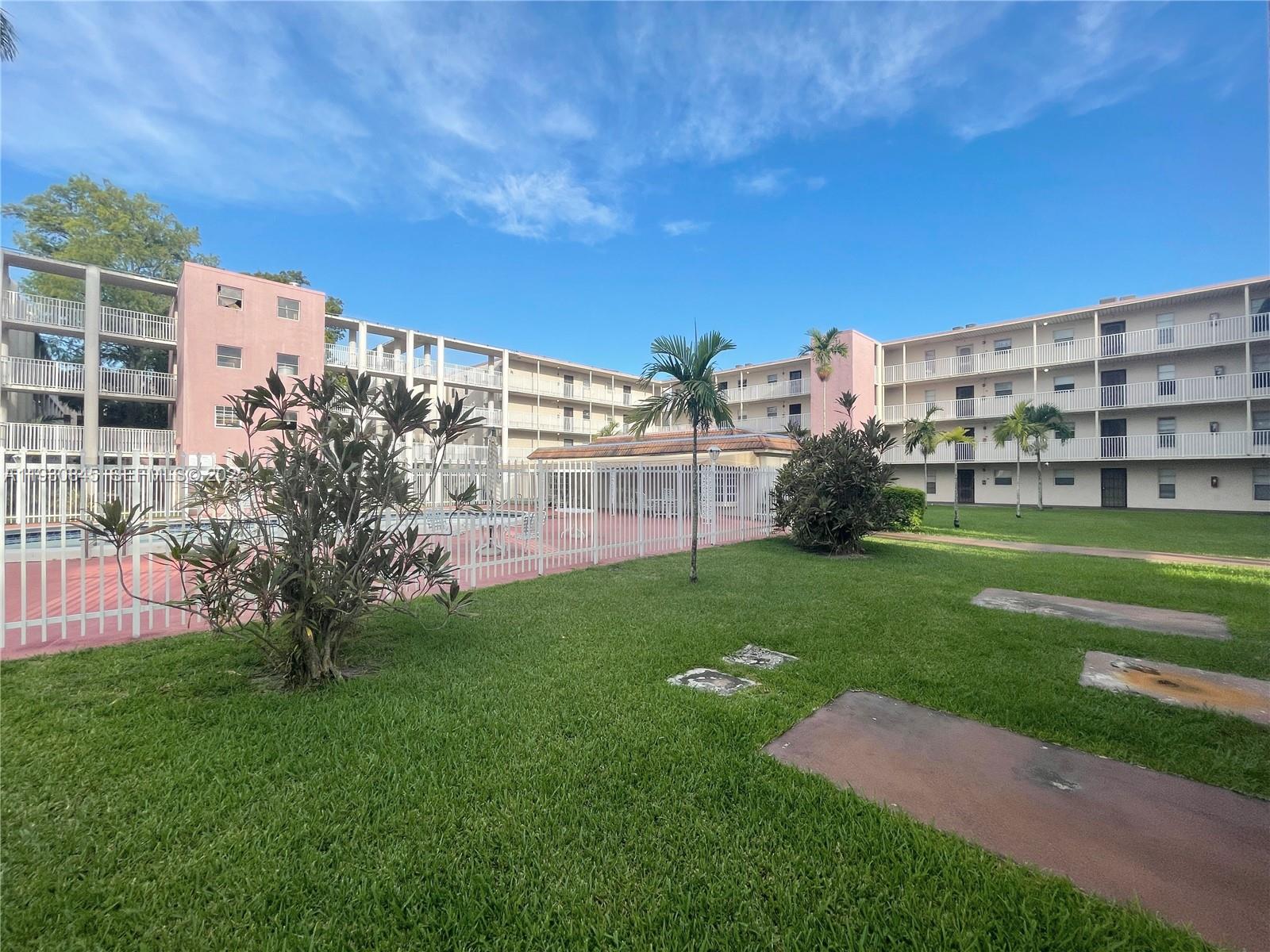 2800 Northwest 56th Avenue, Unit D102 Lauderhill, FL 33313 - Photo 23 of 25 a view of a building with a yard