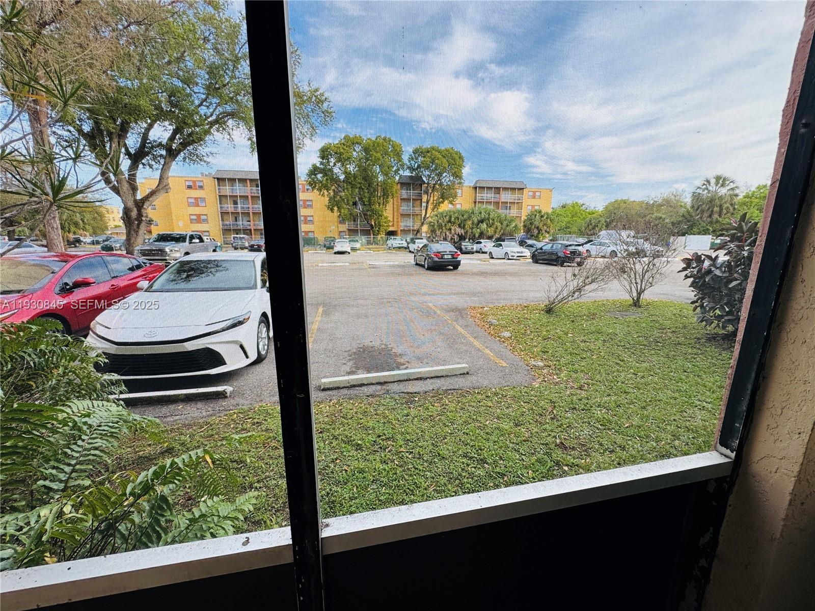 2800 Northwest 56th Avenue, Unit D102 Lauderhill, FL 33313 - Photo 5 of 25 a view of swimming pool from a window