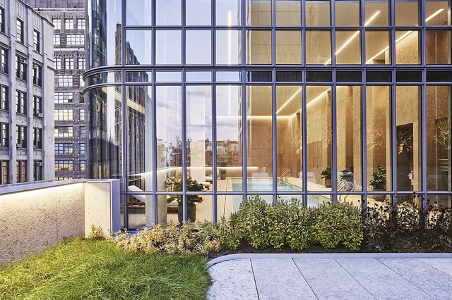 a room with gym equipment and large mirror
