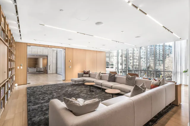 a balcony with table and chairs