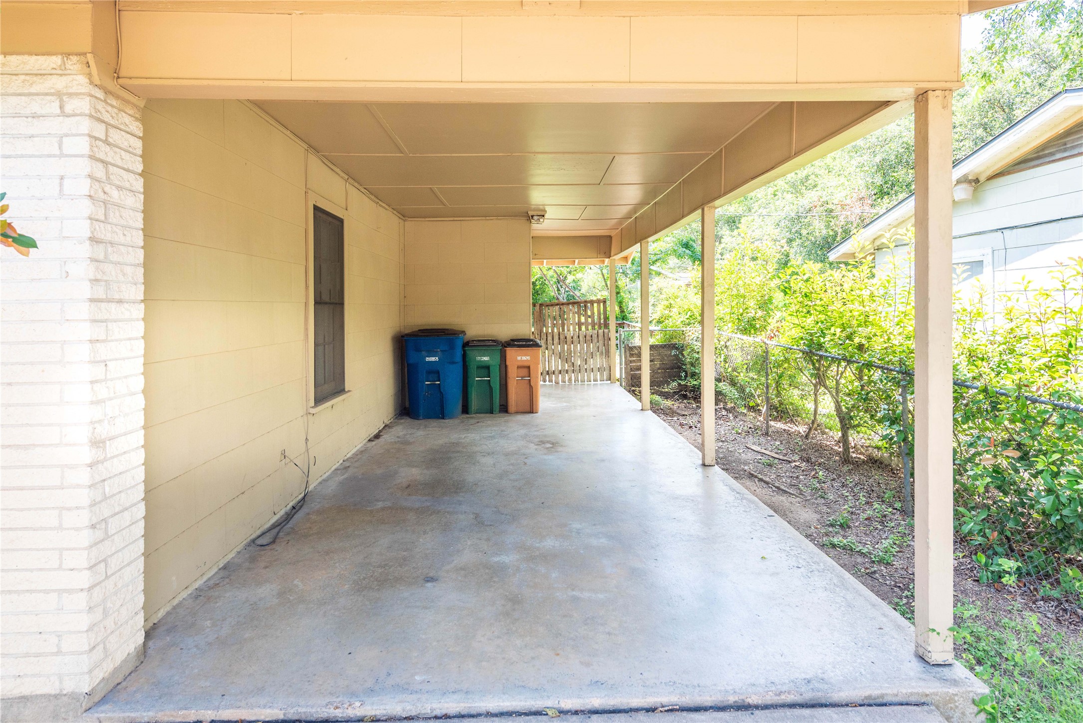 7602 Delafield Lane Austin, TX 78752 - Photo 14 of 17 Covered parking spot sits in front of the washer dryer hook ups.