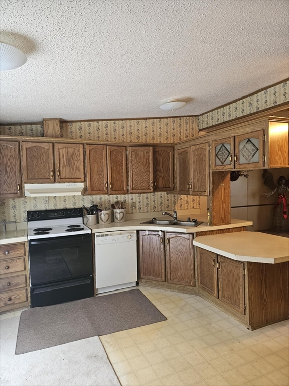 504 Loop Road Savoy, MA 01256 - Photo 4 of 12 a kitchen with stainless steel appliances granite countertop a stove and a sink