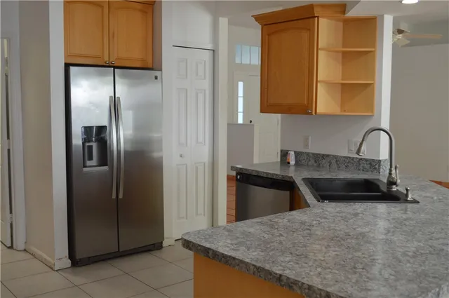 a view of a living room and kitchen with furniture