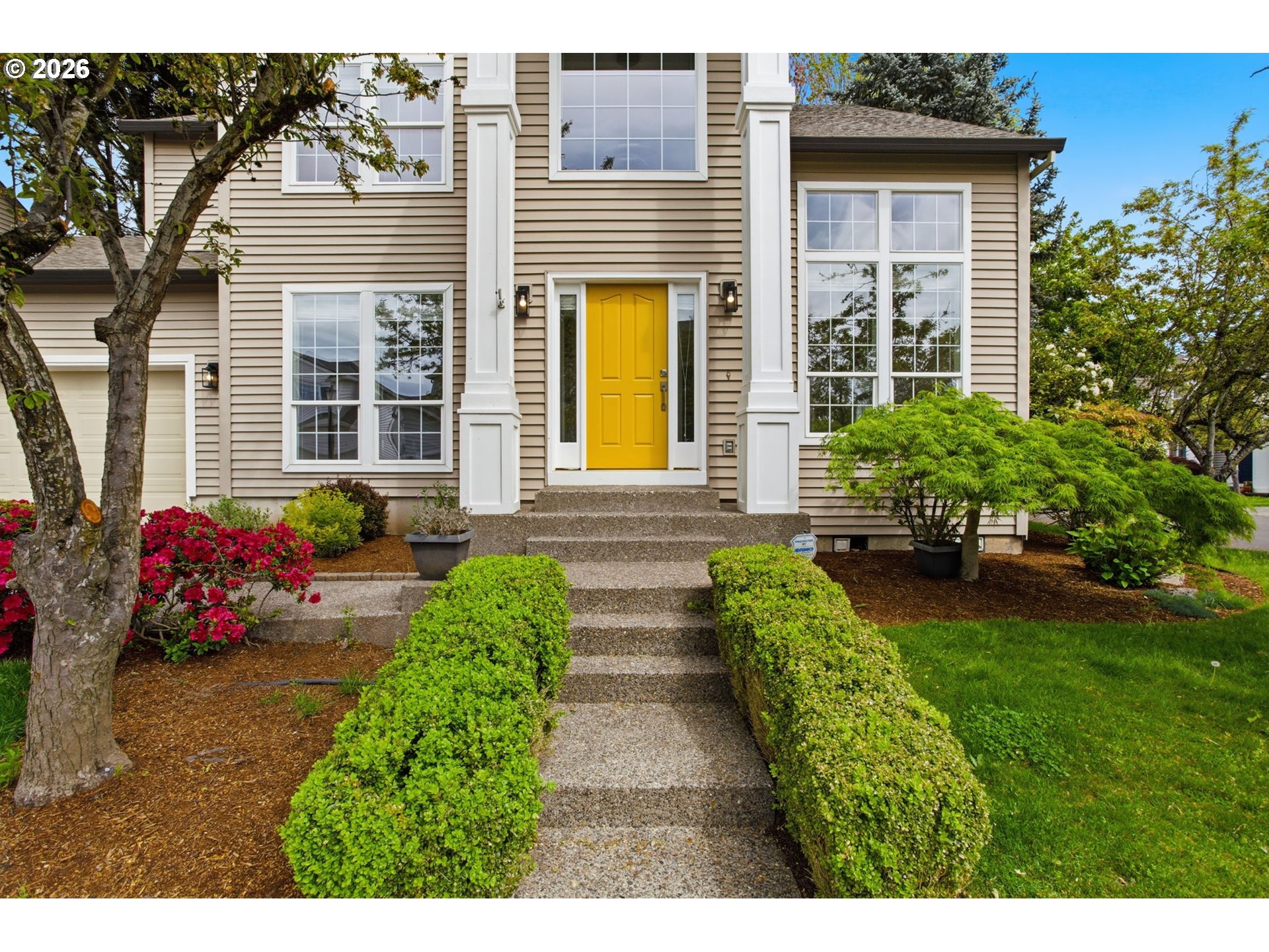 8911 Southwest Gravenstein Lane Tigard, OR 97224 - Photo 5 of 33 a view of a house with potted plants