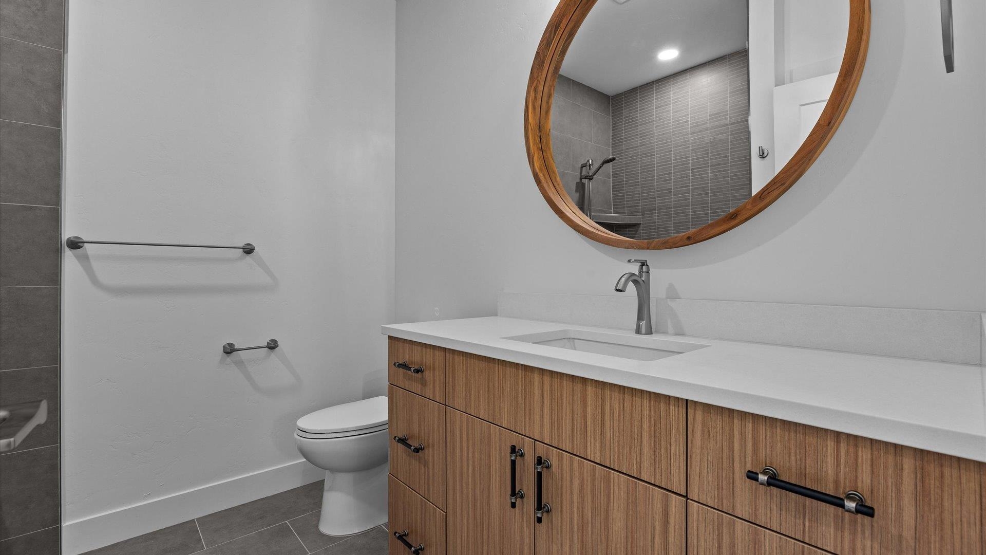 2045 Caleb Street Grand Junction, CO 81507 - Photo 32 of 42 a bathroom with a toilet a sink and mirror
