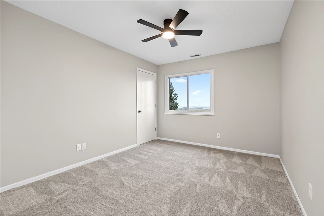 3151 Roesch Boulevard, Unit 6 Fairfield, OH 45014 - Photo 16 of 29 This spacious room features a ceiling fan, plush carpeting, and abundant natural light.