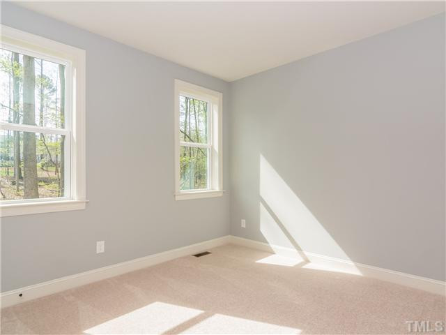7113 Carries Reach Way, Unit 4 Raleigh, NC 27614 - Photo 15 of 25 1st floor guest bedroom