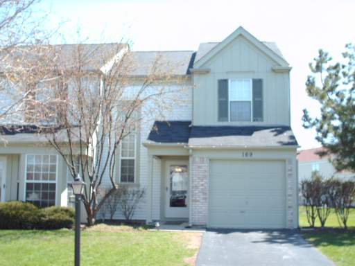 169 North Oltendorf Road, Unit 169 Streamwood, IL 60107 - Photo 1 of 1 a front view of a house with garden