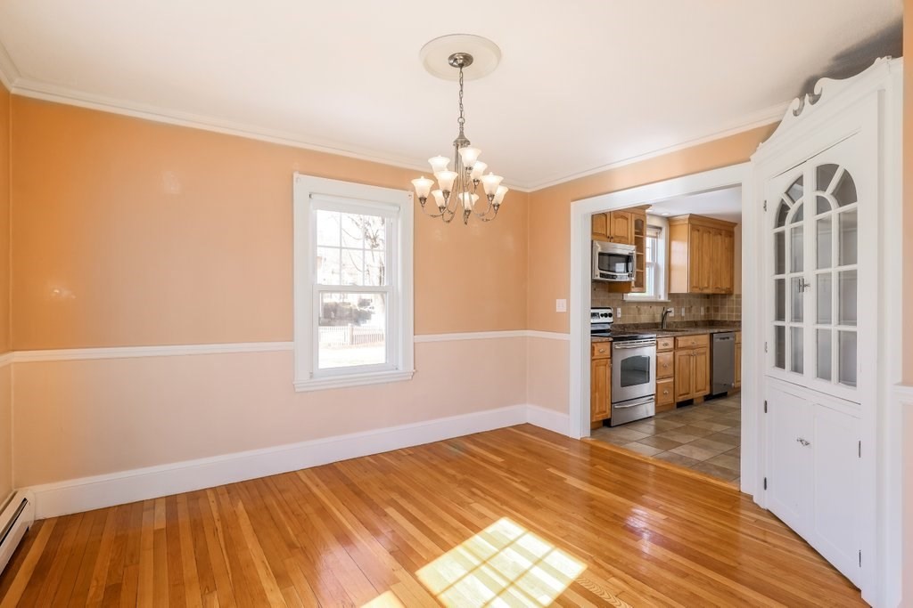 8 Smith Avenue Reading, MA 01867 - Photo 12 of 32 a bedroom with a bed and a window