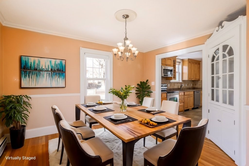 8 Smith Avenue Reading, MA 01867 - Photo 13 of 32 a view of a dining room with furniture and wooden floor
