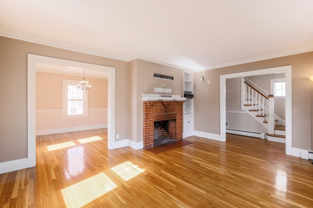 8 Smith Avenue Reading, MA 01867 - Photo 14 of 32 a view of a livingroom with a fireplace