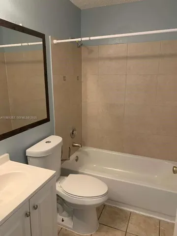 a bathroom with a toilet a sink and a bathtub