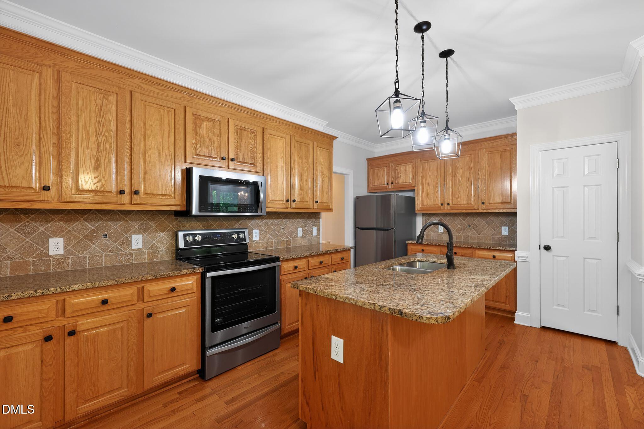 2212 Wheelerbrook Court Raleigh, NC 27603 - Photo 4 of 15 08_2212_Wheelerbrook_Ct_Raleigh_NC_27603