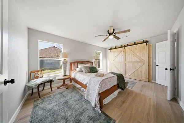 a bed room with a bed and a window