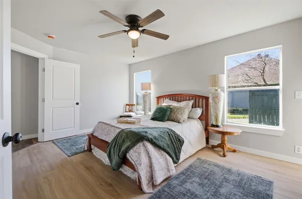 a bedroom with a large bed and a window