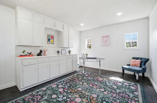 a living room with furniture and a rug