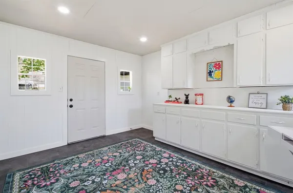 a room with cabinet and window