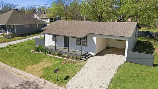 aerial view of a house with a yard