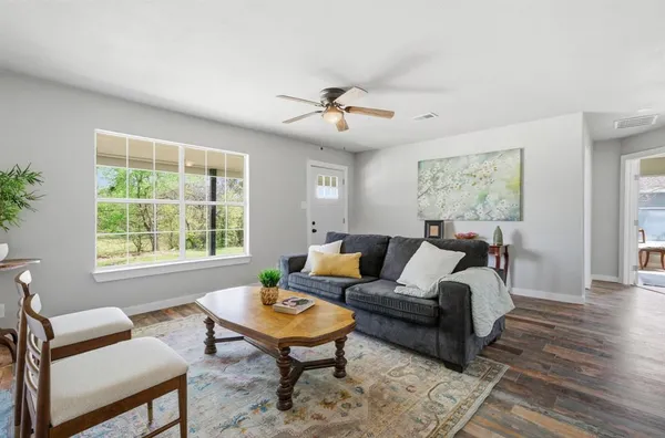a living room with furniture and a window