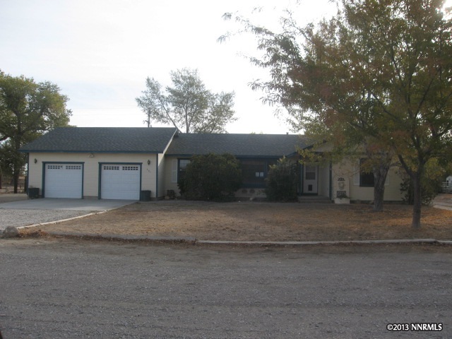 301 Jasper Road Fallon, NV 89406 - Photo 1 of 1 a front view of a house with a yard and garage