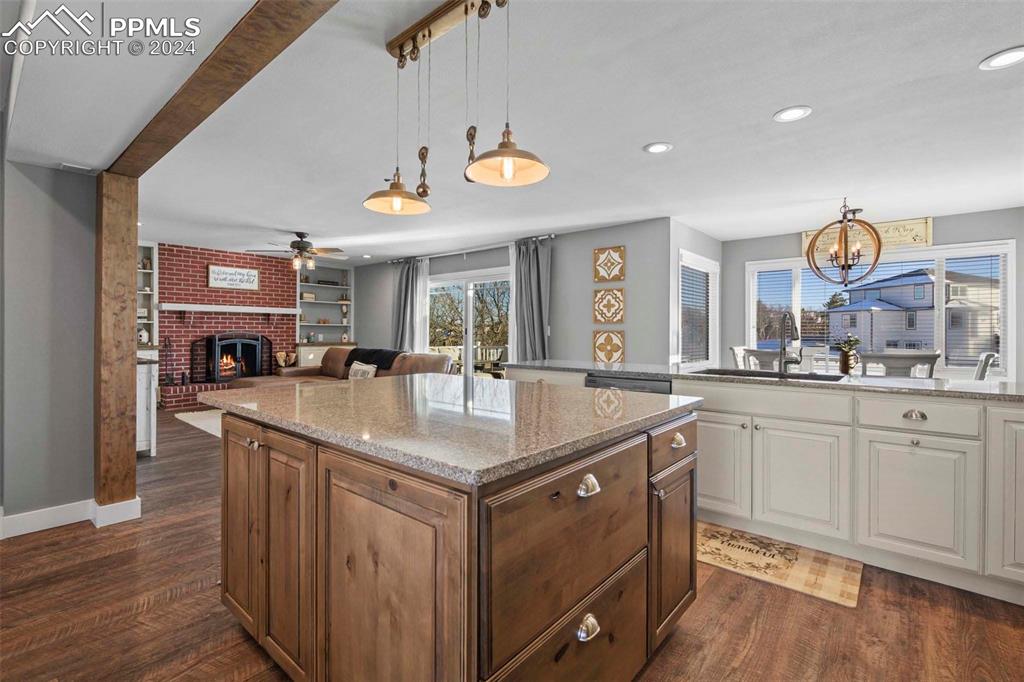 3815 Sierra Vista Road Monument, CO 80132 - Photo 12 of 44 a kitchen with cabinets and wooden floor