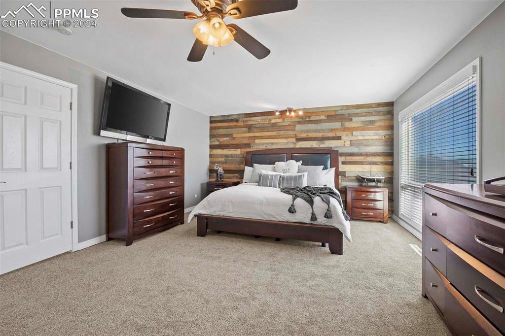 3815 Sierra Vista Road Monument, CO 80132 - Photo 18 of 44 a bedroom with furniture and flat screen tv