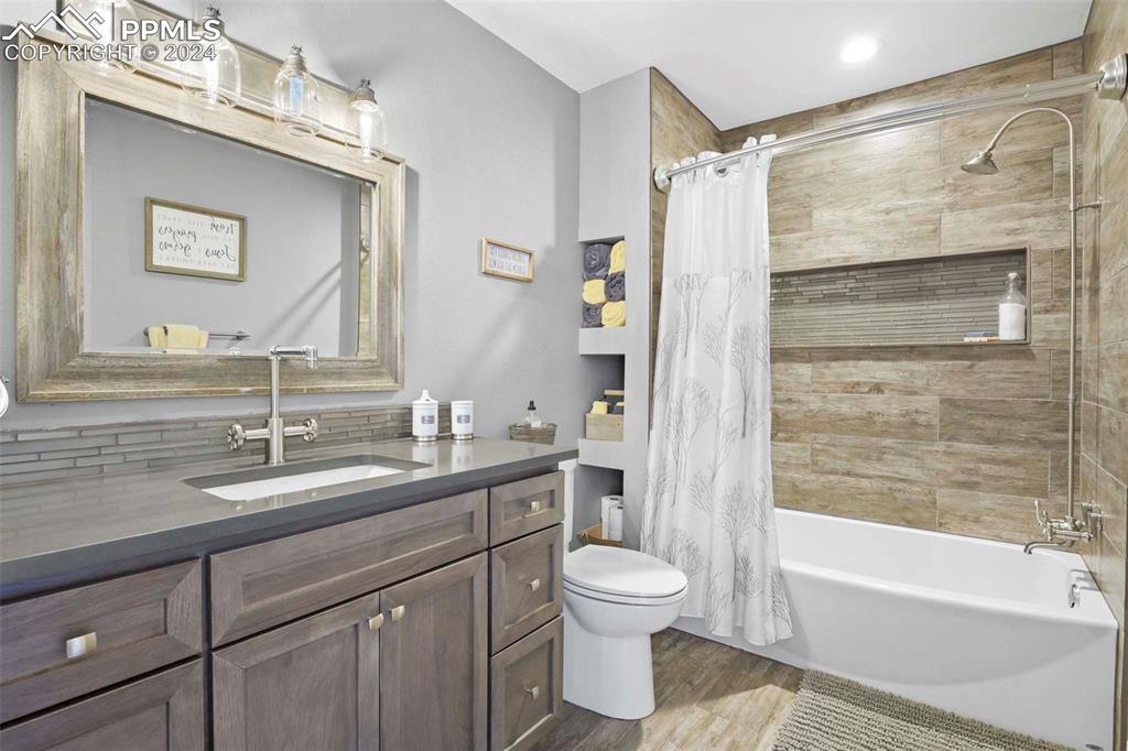 3815 Sierra Vista Road Monument, CO 80132 - Photo 23 of 44 a bathroom with a sink a toilet and shower