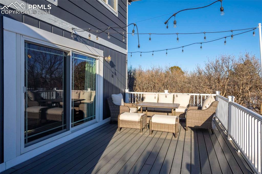 3815 Sierra Vista Road Monument, CO 80132 - Photo 28 of 44 a view of a balcony with couch and wooden floor