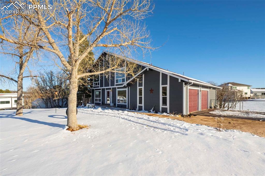 3815 Sierra Vista Road Monument, CO 80132 - Photo 3 of 44 a view of the house with a yard