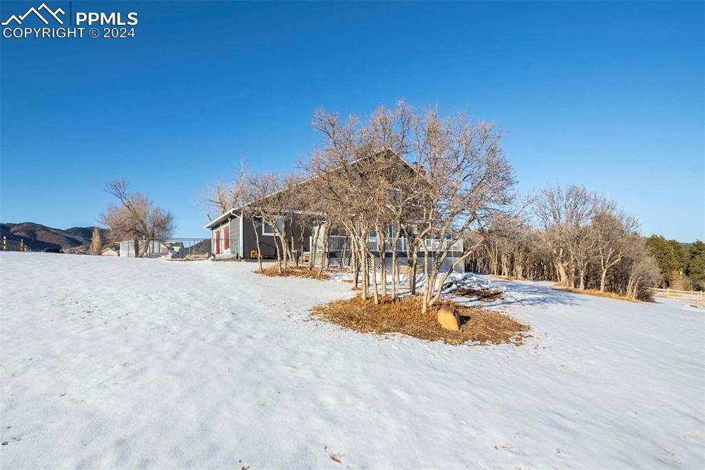 3815 Sierra Vista Road Monument, CO 80132 - Photo 32 of 44 a view of a house with a snow on the road