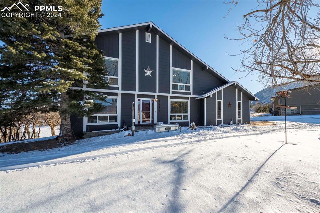 3815 Sierra Vista Road Monument, CO 80132 - Photo 4 of 44 a view of a house with a tree and wooden fence