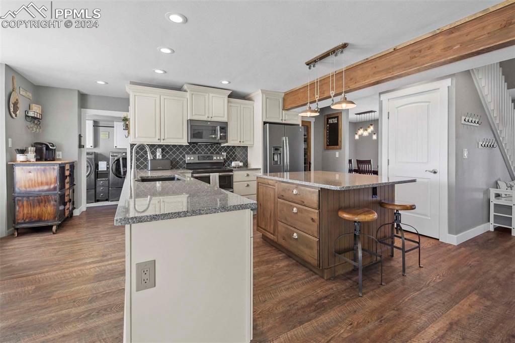 3815 Sierra Vista Road Monument, CO 80132 - Photo 10 of 44 a kitchen with a sink appliances and cabinets