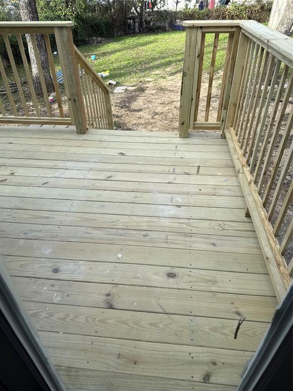 822 Oak Street Grand Prairie, TX 75050 - Photo 3 of 3 a view of wooden balcony