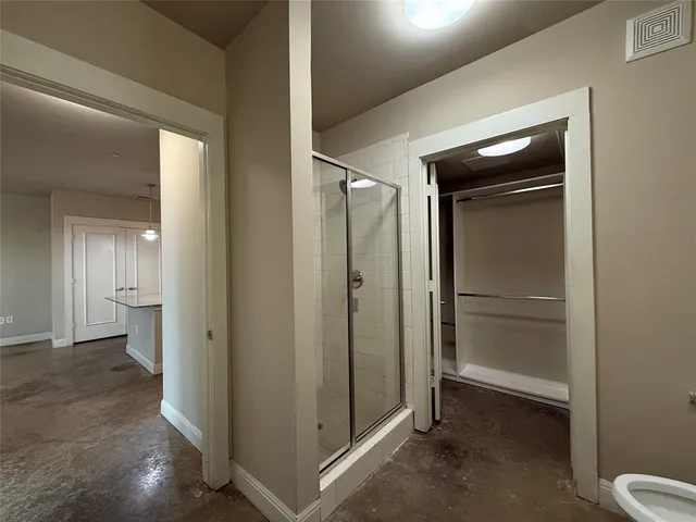 a view of an empty room with a bathroom