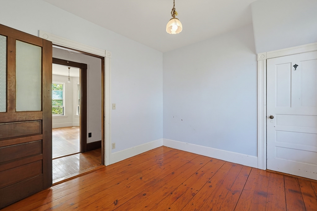 7 Baker Street Worcester, MA 01603 - Photo 31 of 42 wooden floor in an empty room