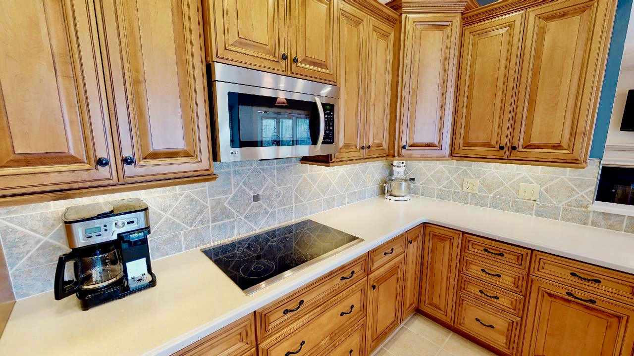 7504 Boscobel Way Raleigh, NC 27615 - Photo 8 of 25 Custom tile backsplash and under cabinet lighting! Kitchen