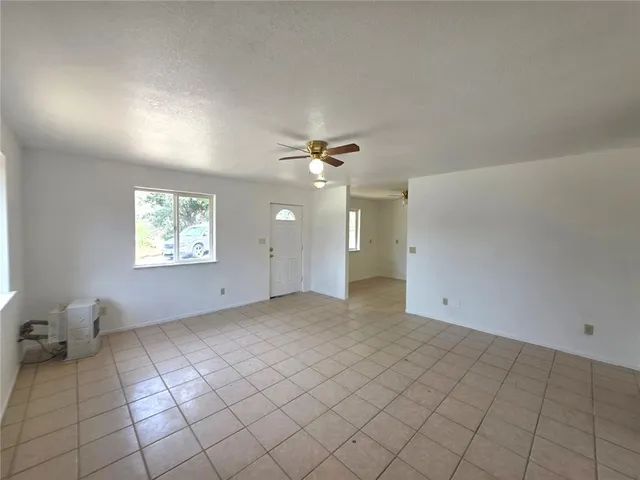 a bathroom with a toilet a sink a mirror and shower