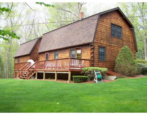 39 Casey Road Spencer, MA 01562 - Photo 4 of 22 a front view of a house with a yard
