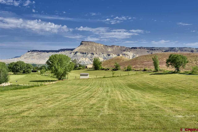 a view of an ocean and a mountain