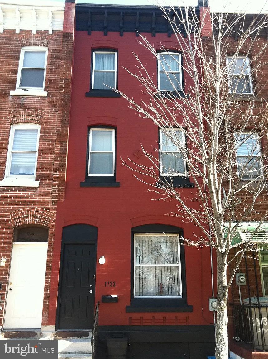 1733 Willington Street Philadelphia, PA 19121 - Photo 1 of 9 a building view with a brick wall