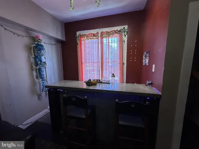 a bathroom with a sink a mirror and a window