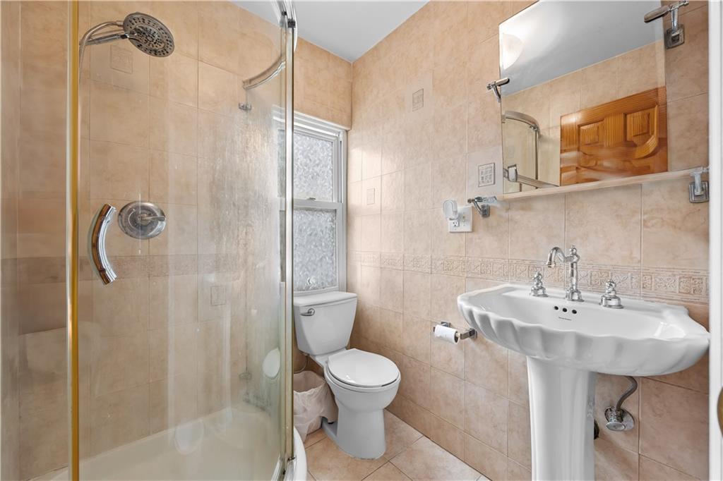 8 Lester Court Brooklyn, NY 11229 - Photo 16 of 25 a bathroom with a sink toilet and shower