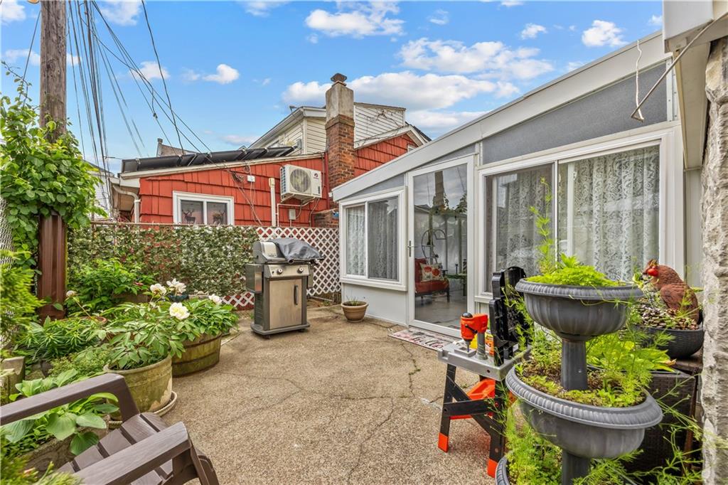 8 Lester Court Brooklyn, NY 11229 - Photo 23 of 25 a front view of a house with outdoor seating