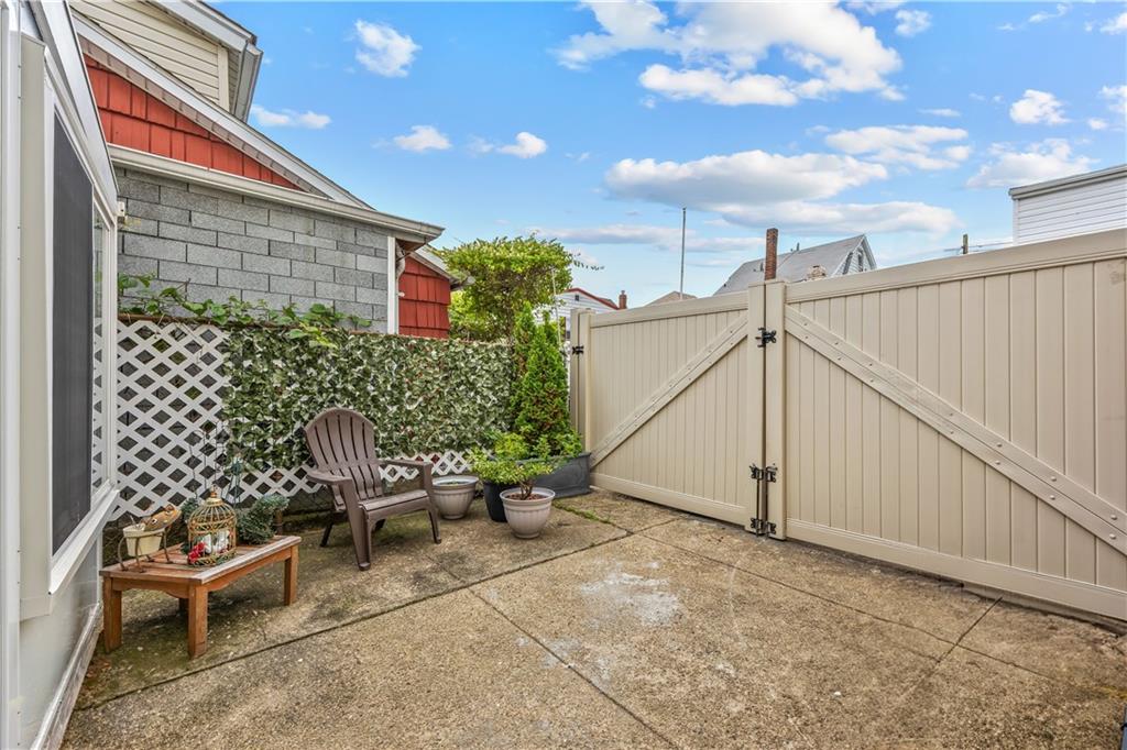 8 Lester Court Brooklyn, NY 11229 - Photo 24 of 25 a backyard of a house with chairs